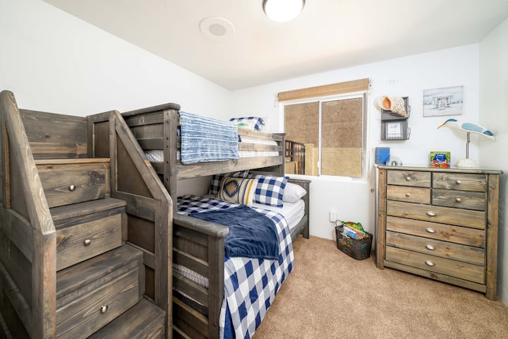 The "Lake Time" Bunkbed Room was designed to be kid-friendly; however, it may accommodate adults comfortably. 

There is a full bed below and a twin on top. Enjoy a basket of sensory toys for the little ones.