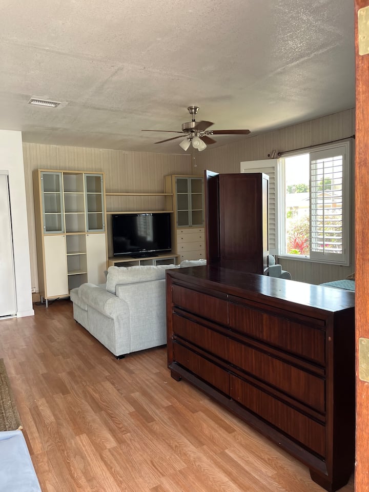 Entertainment center: complete with Samsung 42 inch TV, plenty storage & conveniently placed to setup your own playstation. Bedroom area available with a partition providing privacy.  Plenty of drawers to store your travel items and bath towels.