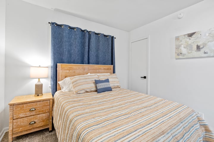This bedroom features a full bed and comfortable memory foam mattress.