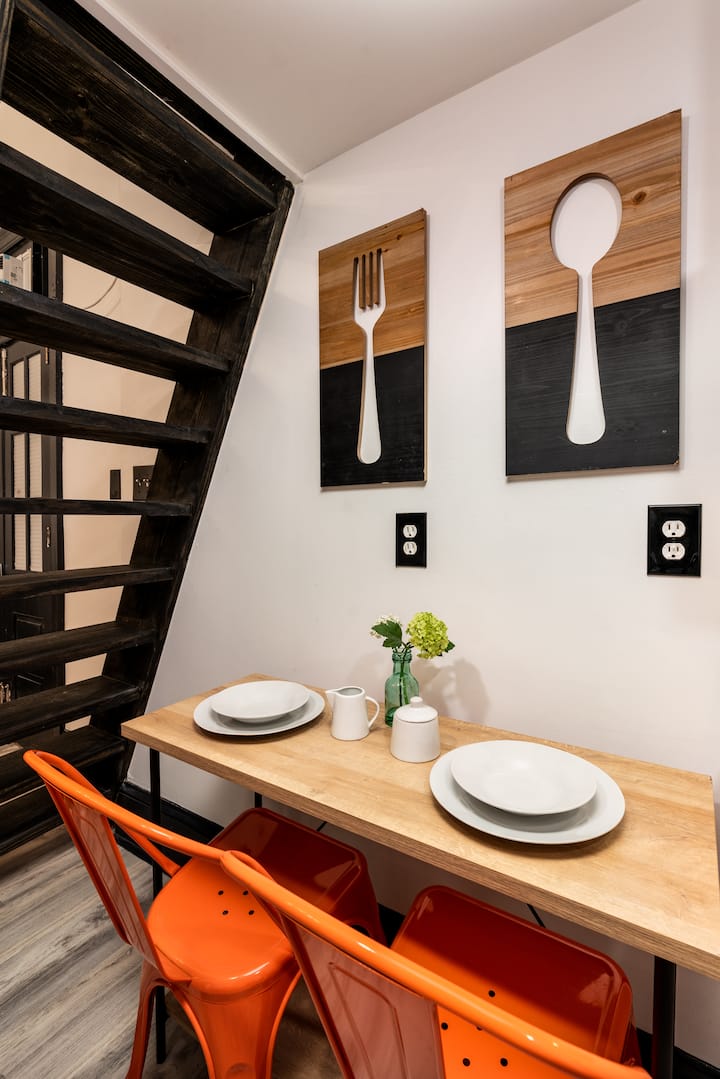 Dining area for an intimate meal that features outlets to be easily converted into a workspace