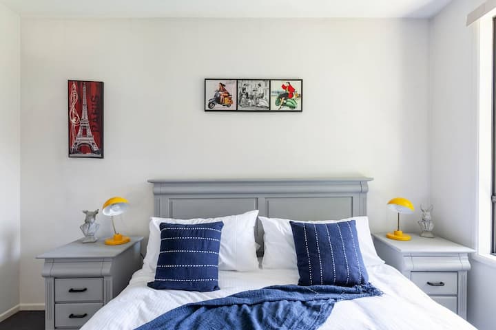 Master bedroom with solid carved timber King bed and matching side tables (No flat-packs here!) Imported handwoven throws and cushions accent the space for a comfortable yet luxurious feel