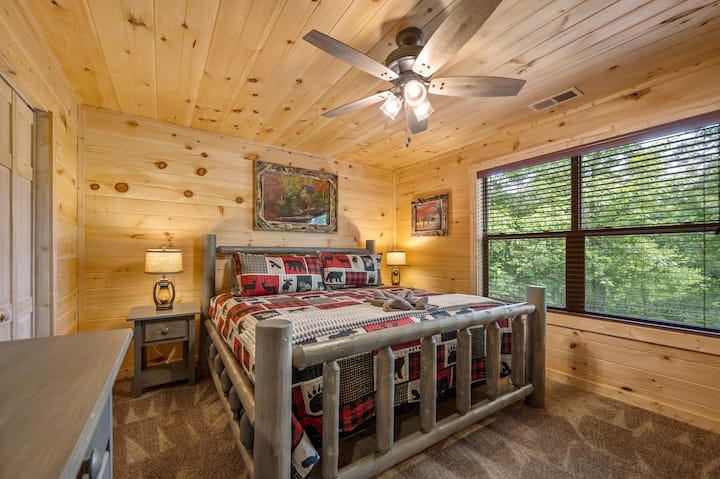 The 3rd bedroom is located upstairs on the back of the cabin.  The bedroom features a king-size bed and a 43" Smart TV.