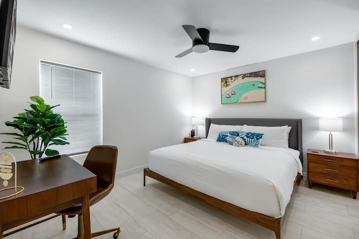 The Palm Springs Room features a beautyrest king size bed, smart TV, full length mirror, and desk/chair.