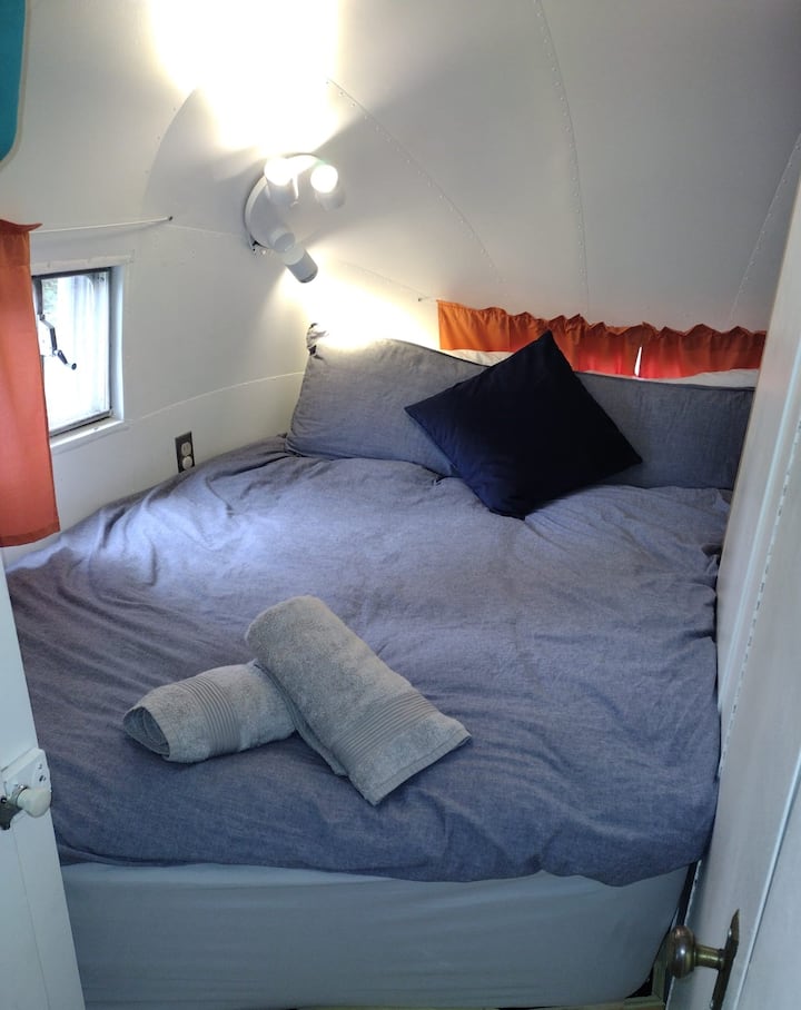 The incredibly comfy memory foam mattress which is 355mm depth and was custom cut from a California King. 1397mm width with a length of 2032 mm long on one side angled to 1778 mm on the other.  Everyone who has slept on the bed has loved it.