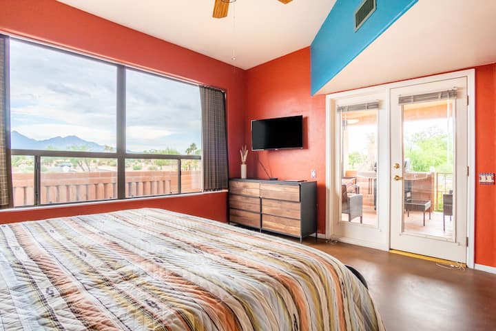 Bright, sunshiney bedroom, with room blackening shades, has great mountain views, opens onto private patio, and television.