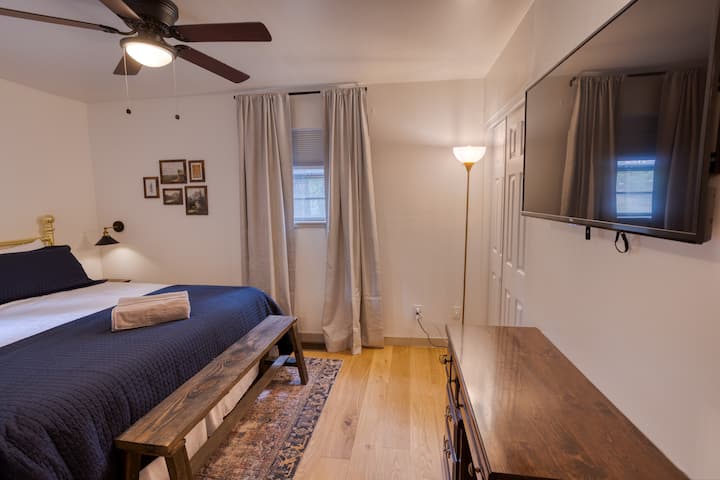 Main level bedroom with king bed