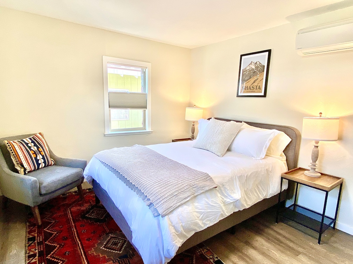 Bedroom 1 with comfy king bed and luxury linens, mini split for AC and heat, and closet