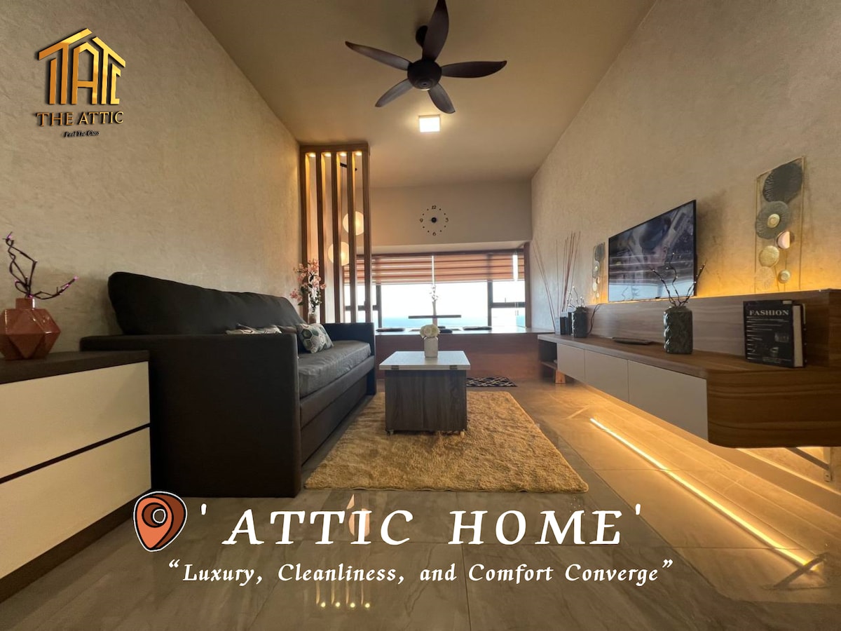 A modern living area is presented, featuring a sleek entertainment unit against a light-colored wall. Natural light enters through large windows, complemented by contemporary lighting fixtures. A comfortable seating arrangement occupies the space, with decorative elements enhancing the aesthetic appeal.