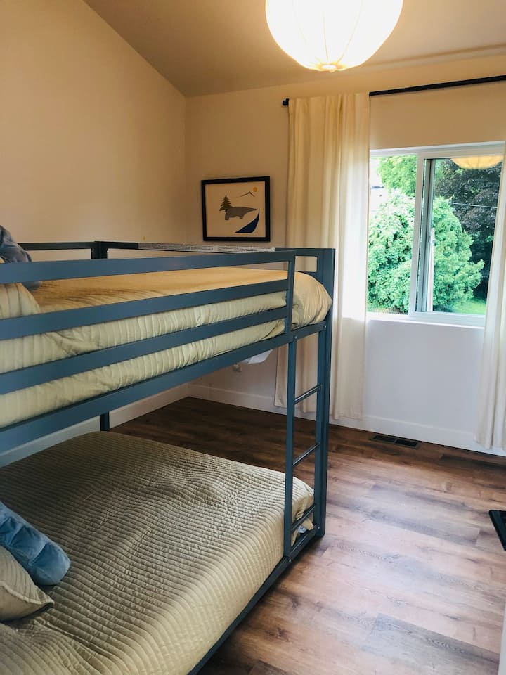 Bedroom 2: The Cloud Room/Bunk room. 2 full bunk beds in playful room with kids books/toys. 