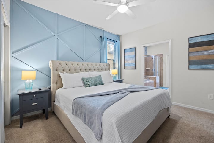 The first floor master bedroom has a king bed and private ensuite with direct access to the patio.