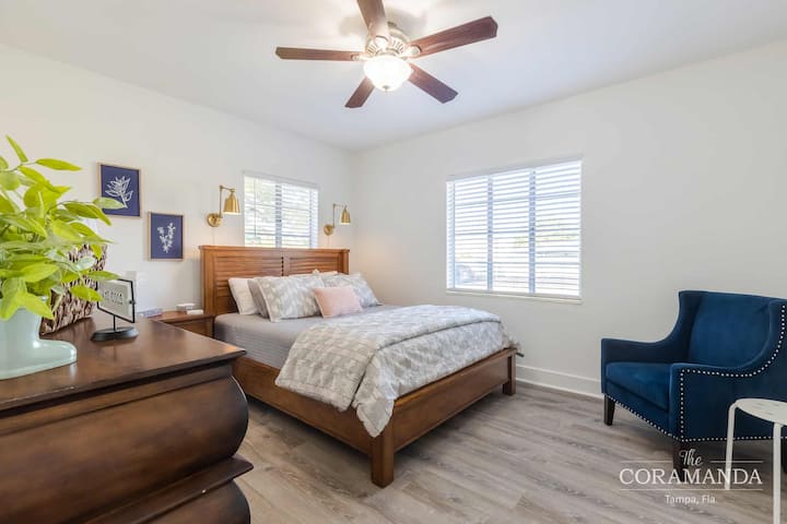 Bedroom 2. A queen-size firm mattress and a cozy reading chair. 