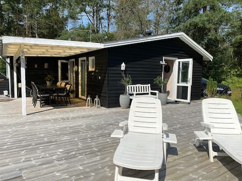 Holiday cottage with spa, outdoor sauna and pool.