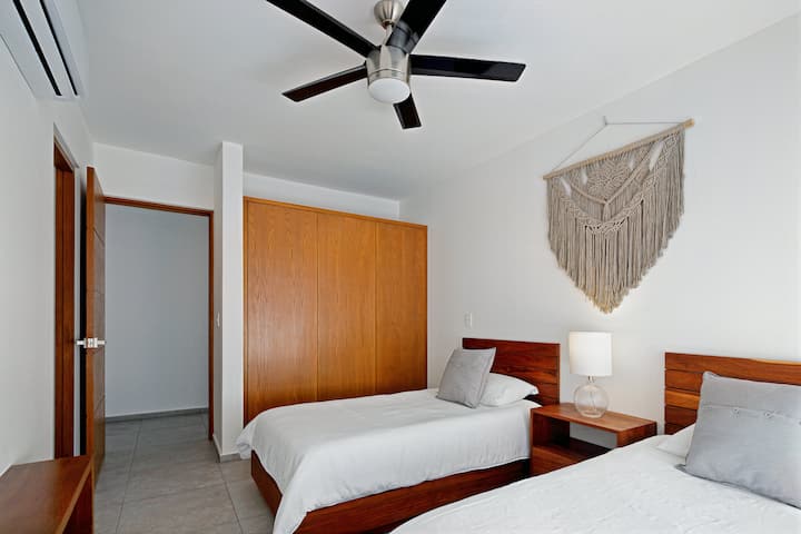 The two middle rooms feature comfortable twin beds