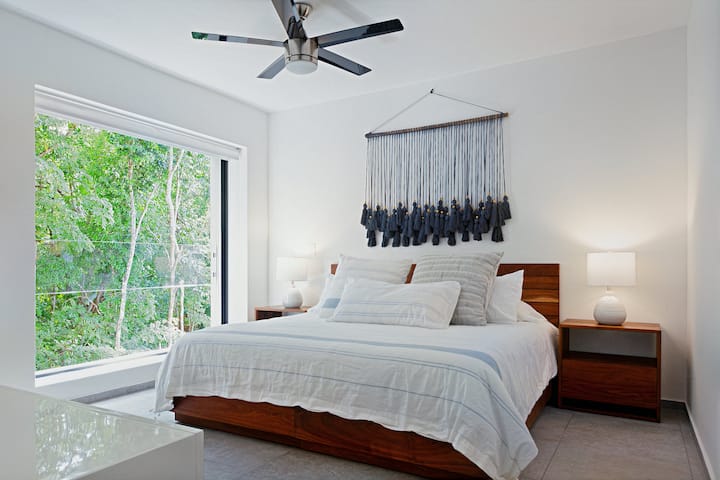 This bedroom is located on the back side of the home, overlooking the Sendero (trail).  The whole window opens up and goes into the wall.