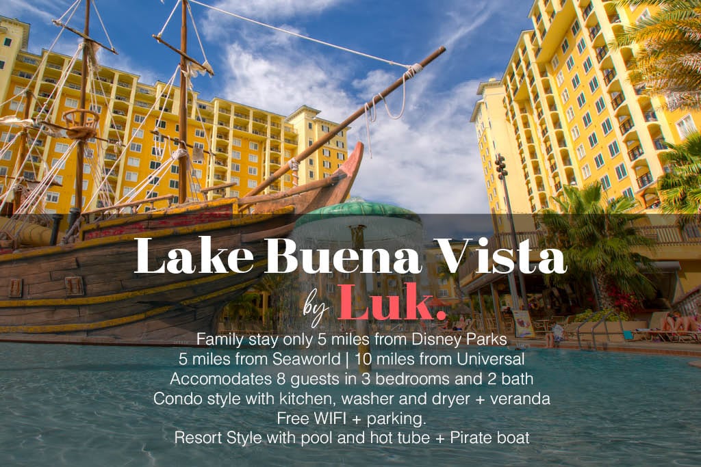 A vibrant resort area is depicted, featuring a pool surrounded by colorful buildings. A pirate ship-themed structure adds unique character to the setting. Lounge chairs sit near the water, inviting relaxation, while palm trees enhance the tropical appeal. The atmosphere is family-friendly, catering to guests of all ages.
