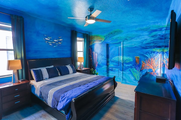 Experience the serene underwater magic in our Finding Nemo themed master bedroom! With a king-size bed, a 65” Smart TV, a private bathroom, a closet organizer, and direct pool access, it's the perfect retreat for your family. Dive into the adventure!