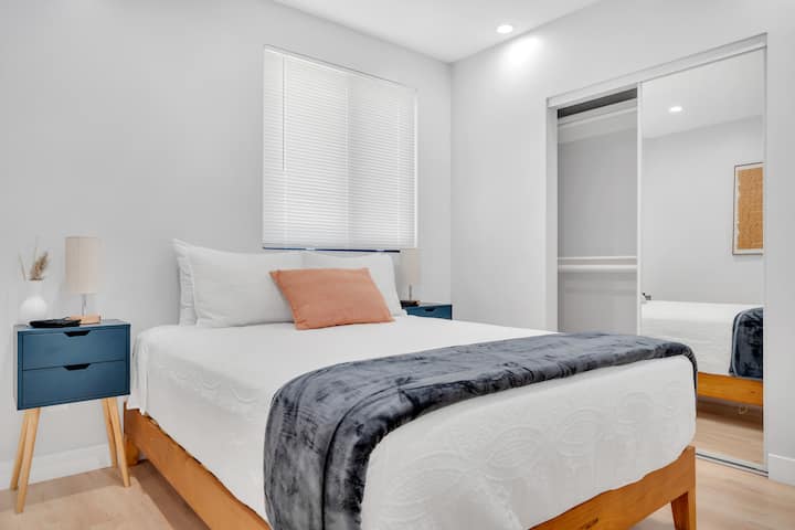 Bedroom 4: Queen bed with closet space, and nightstand.
