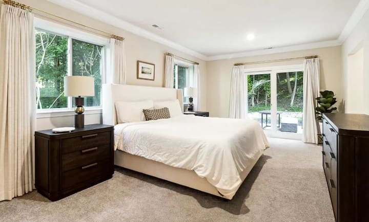 Main suite offers a comfortable king size bed and private patio along with en-suite bathroom. Smart TV in each bedroom.