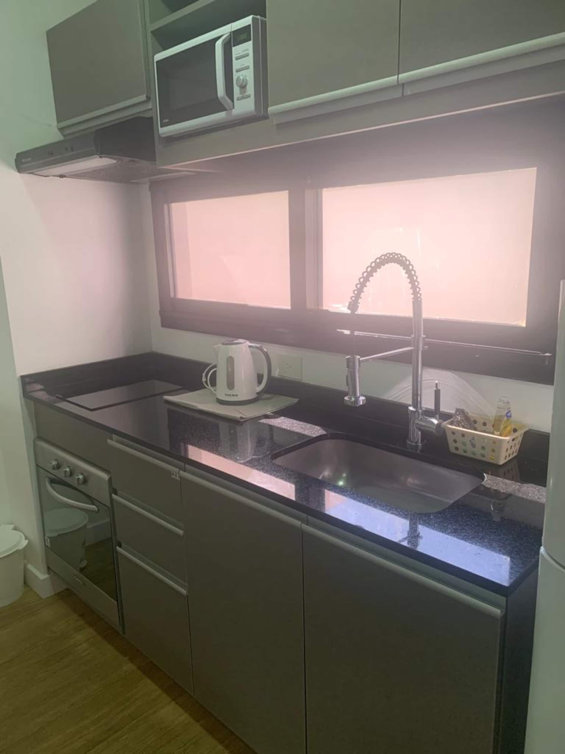 Kitnet com terraço e área de churrasco em Palermo