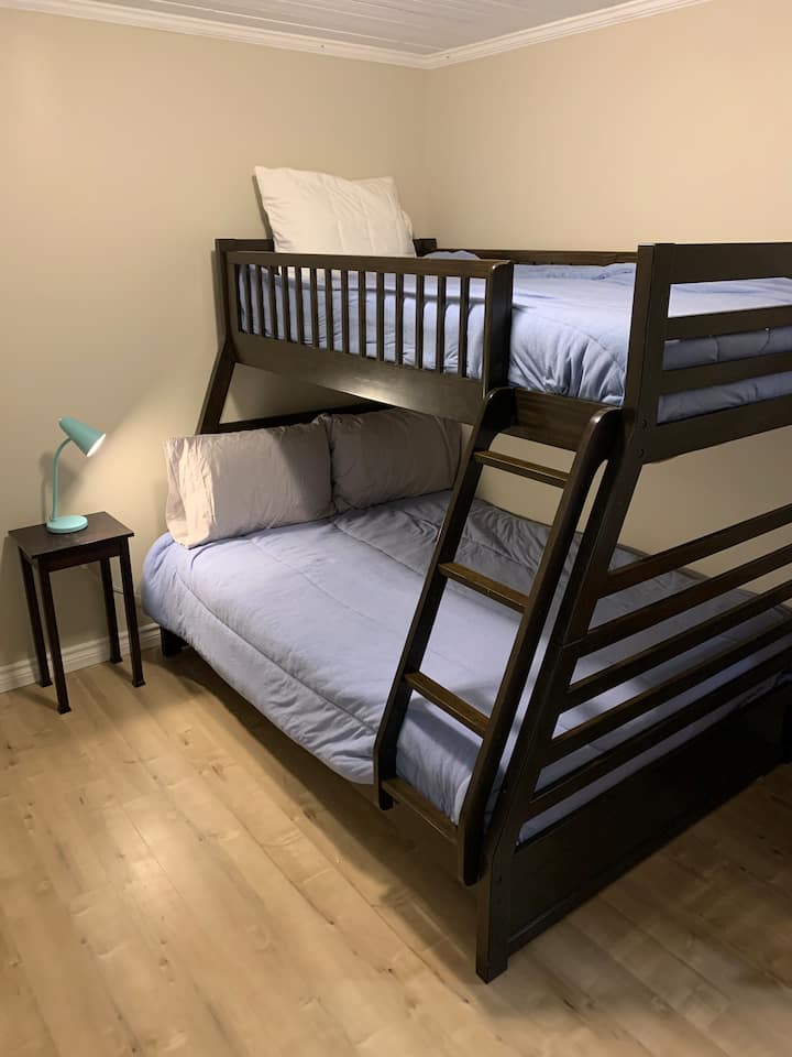 Second bedroom with bunk beds including one double and one single.