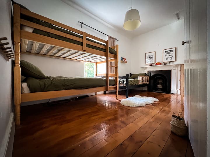3x single bed room with view of courtyard