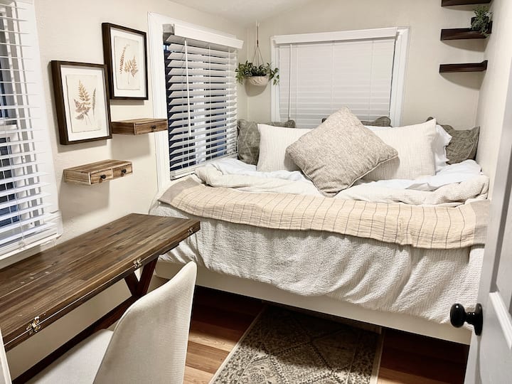 Bedroom 2:  Sun Library
This back bedroom is a full-size bed that can comfortably sleep two adults who are 5'10 or under.  Since the full-size bed is built in it can be constricting with height.  You can store your suitcases underneath the bed. 