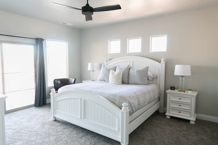 Master Suite #2 with king bed. Step out to the private balcony to relax. 