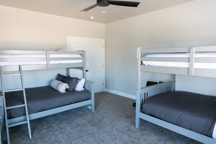 Kids party room...I mean bedroom...with bunk beds. What kid doesn't love bunk beds? There are three full beds and one twin bed in this room. 