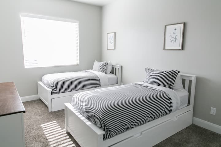 Two twin beds, both with trundle beds that slide out so four can sleep comfortably in this room. And, of course there is a smart TV for all their entertainment needs. 