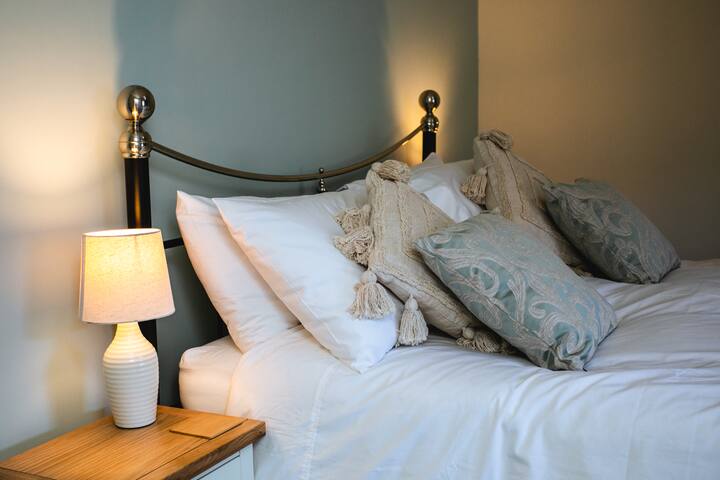 Relax in the beautiful master bedroom. The ensuite has a spacious, walk-in rain shower. 