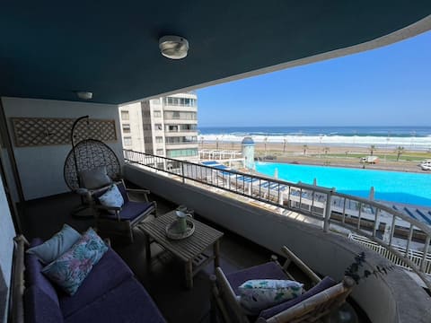 Apartment with ocean and pool views.