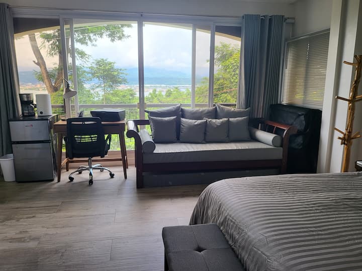 Our Master unit is furnished with a Full King bed to give the ultimate comfort to the patriarchs of your Ohana! The bedroom is equipped with a 55-inch smart tv. There's also 
a full workstation with a view for the ultimate relaxation/inspiration! 