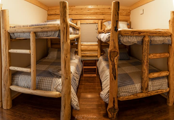 Cozy third bedroom complete with 4 twin beds. Great for a kids room. All bedrooms have blackout blinds. Located on main level. 