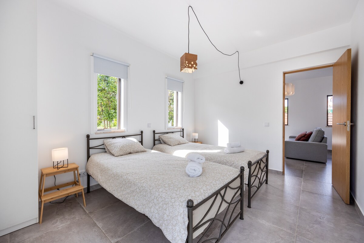 Bedroom with 2 single beds and view to the front and back yard