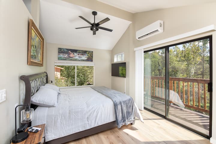 Master bedroom with view of deck