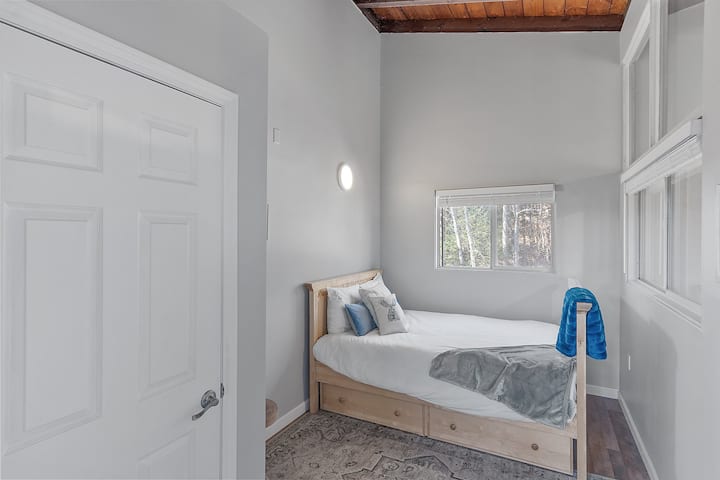 Bedroom on the second floor with a Full size bed and a twin size trundle underneath.