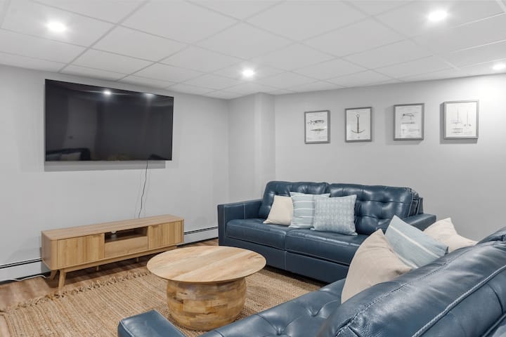 Living room on the lower level with two queen size sleeper sofas.