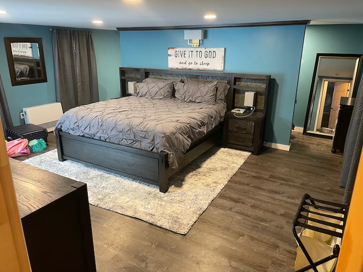 Newly updated, master bedroom with King bedroom suite with walk through closet behind bed, private slider access to the hot tub and grilling deck from your room. Also with laundry and luggage organizer.