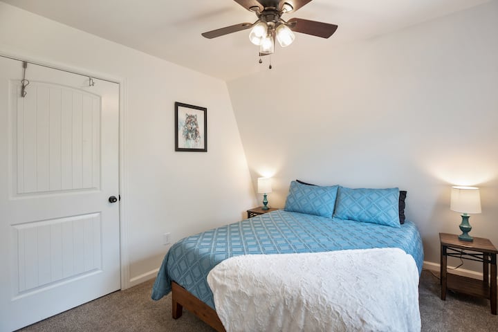 The first bedroom at the top of the stairs has a memory foam queen mattress to rest easy and get a good night's sleep.