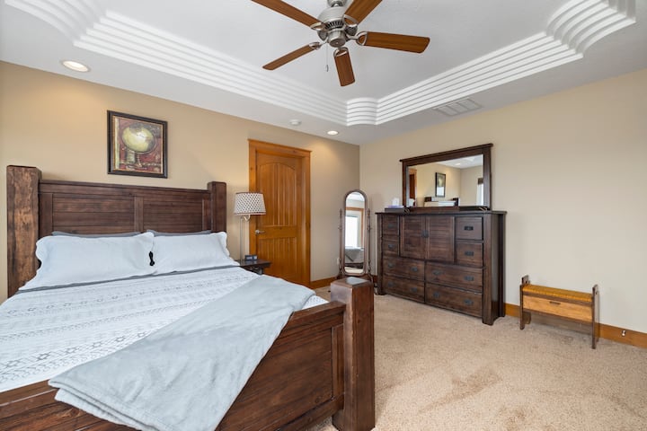 Comfy queen size memory foam mattress and dresser with generous storage space (check the dresser doors for extra blankets)

Both side tables have built in wireless charging as well as front facing USB and 110v plugs.