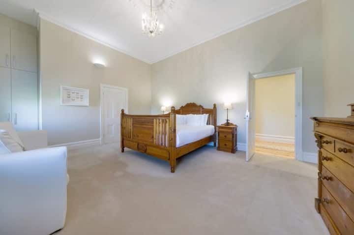 This bedroom retains some of the charm of previous eras. Enjoy your own ensuite and views of the garden.