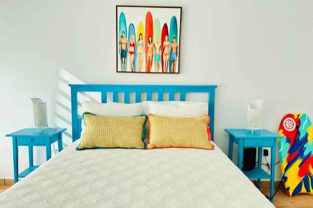 Queen size bedroom on the first floor with direct access to patio