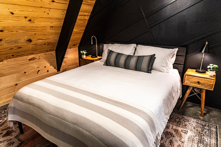 Downstairs bedroom with queen bed