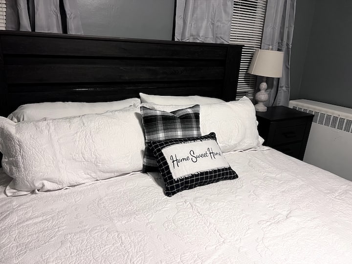 Large and spacious bedroom with a king sized bed and walk in closet! Each bedroom has darkening curtains and touch lamps with USB charging ports!