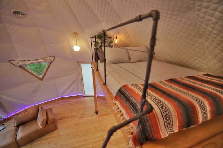 The loft bed is a queen sized memory foam bed, as well as we provide a blow up bed for additional guests.