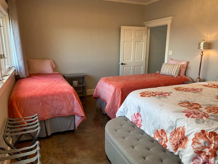 This cheerful bedroom has stunning lake views.  It is on the first floor and has one queen and 2 XL twins. This room shares a full bathroom with another bedroom.