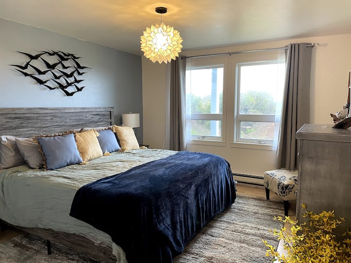 Bedroom with king-sized bed on entry level of home
