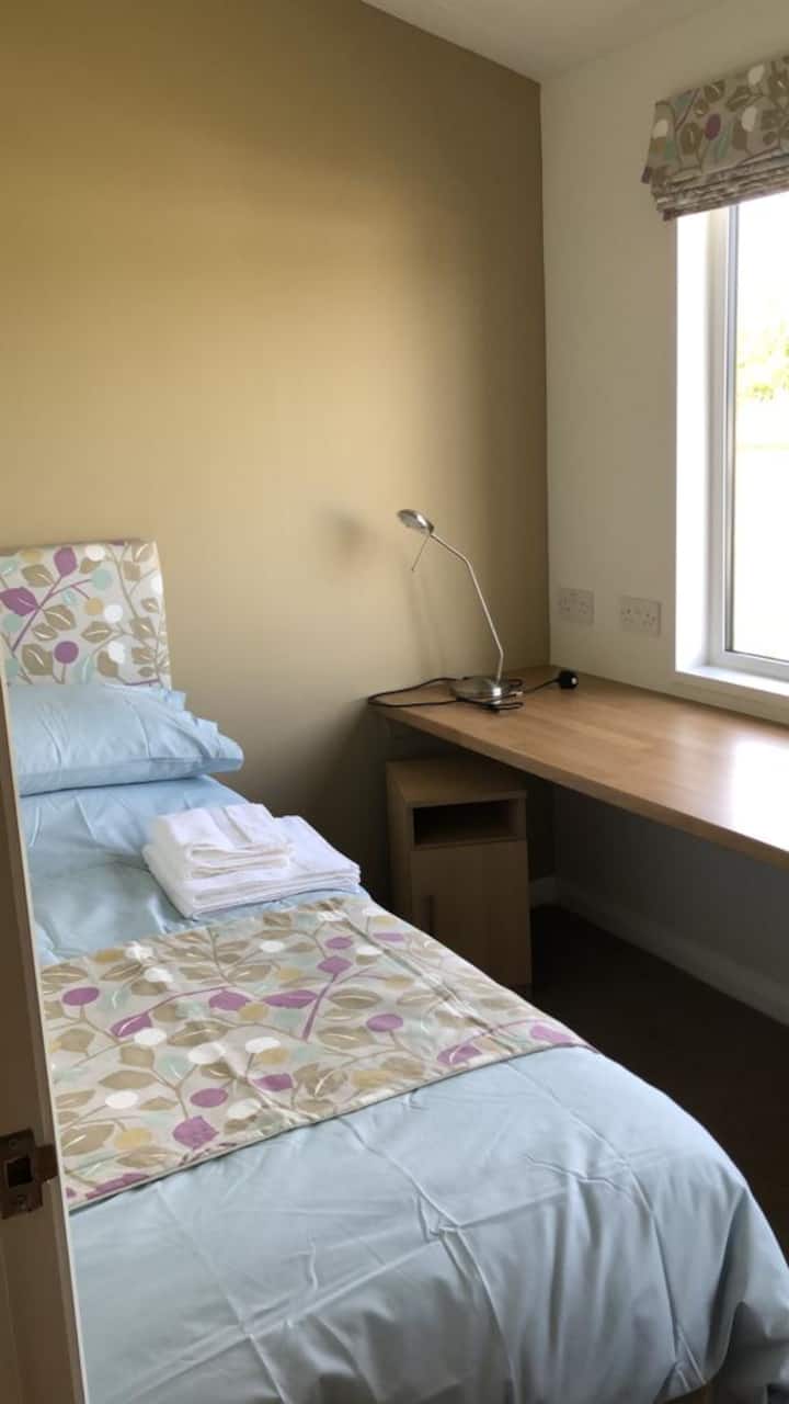 Single bedroom with desk and chair