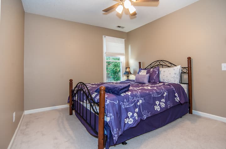 2nd Bedroom: Bright and inviting, featuring a queen bed and charming decor for restful nights!
