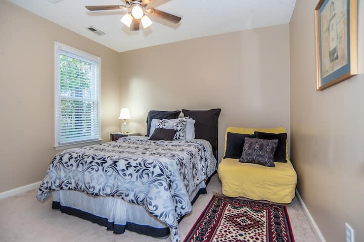 Bedroom Retreat: Relax in style with a plush bed, colorful futon, and bright, inviting light! With futon!
